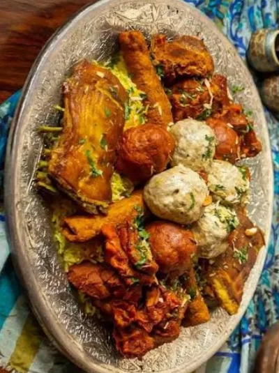 WazwanThirty-odd courses off a shared copper tarami, cooked overnight by a waza and his team. A wedding institution, not a menu item.